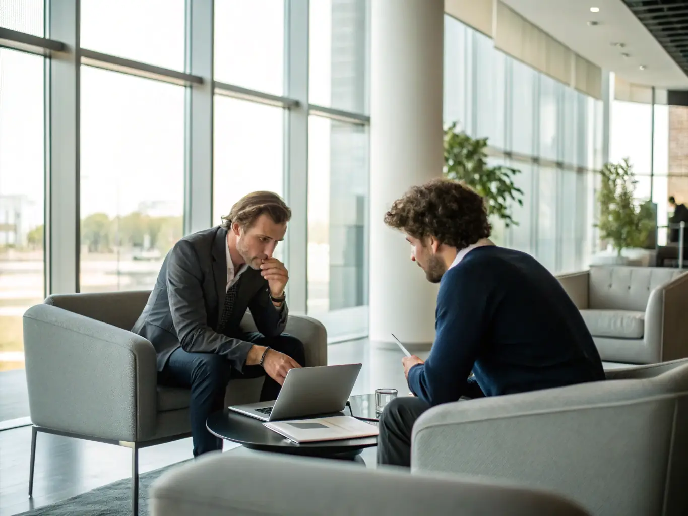 A minimalist image of a consultant providing strategic advice to a business owner, emphasizing LuxEthos' commitment to tailored solutions and sustainable growth.